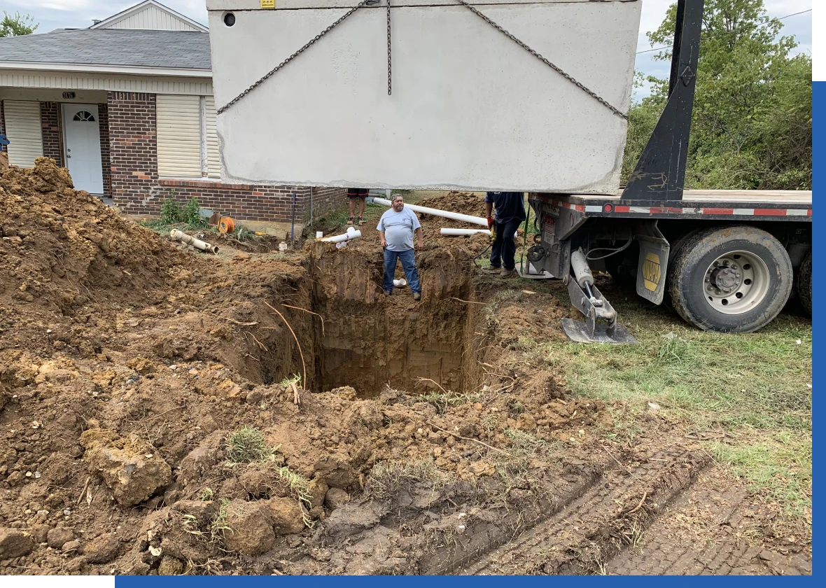 Large excavation site with worker inside